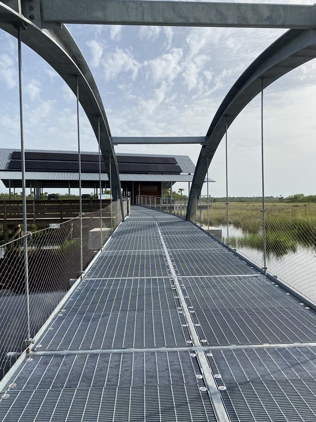 pedestrian suspension bridge over marsh