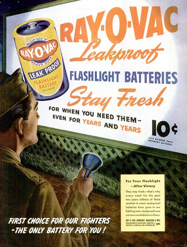 Advertisement for Ray-O-Vac leakproof batteries, 1945. Life Magazine, February 12, 1945, p. 113. An illustrative color ad. A white soldier in uniform shines a flashlight on a billboard advertising Ray-O-Vac batteries. “Flashlight batteries stay fresh for when you need them – even for years and years. 10 cents.”