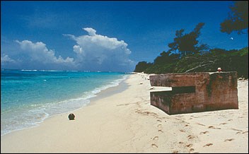 Large piece of metal on a beach. Large piece of metal on a beach.