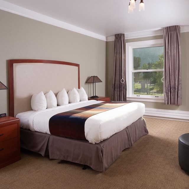 Hotel room with a bed and view out the window